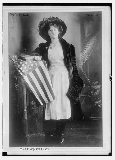 Dorothy D. Frooks standing at flag-draped dais