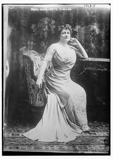 Mme. Marguerite-Durand seated