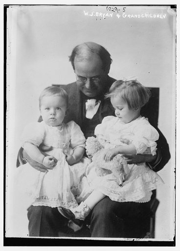 W.J. Bryan holding two grandchildren on his lap