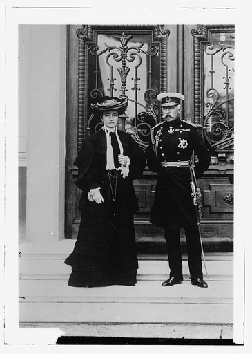 Duke and Duchess of Connaught, standing on steps before elaborate doors