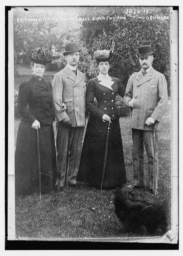 Ex-Empress of Russia, George of Greece, Queen of England, and King of Denmark standing together on lawn