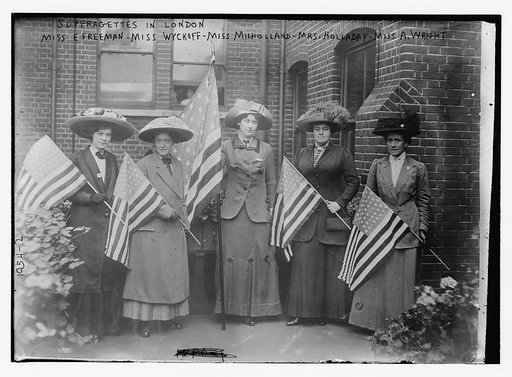 Suffragettes holding flags:  Miss E. Freeman, Miss Wyckoff, Miss Milholland, Mrs. Holladay, and Miss A. Wright