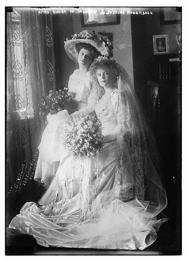 Mrs. Roger M. Minton and Justine Ingersoll seated holding bouquets