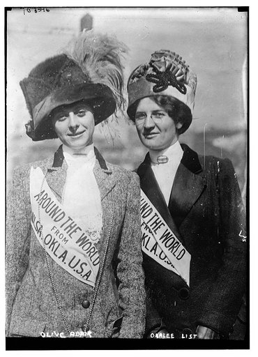 Olive Adair and Orelee List wearing "Around the World from U.S.A." banners