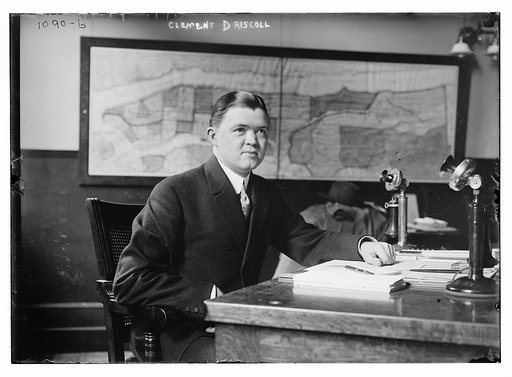 Clement Driscoll seated at desk