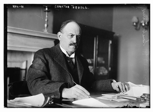 Senator Terrell writing at desk