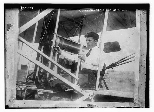 A.L. Welch in right biplane