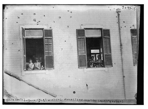(Note shots)  soldiers at windows of monastery ready to shoot looters