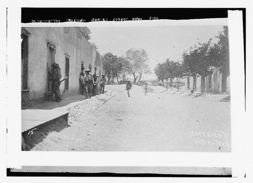 Insurrectos crossing Juarez St. under fire