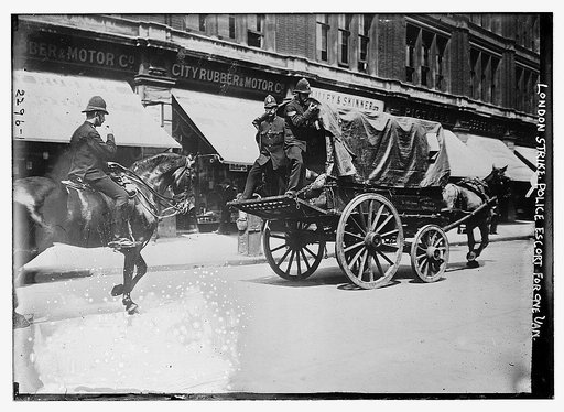 London Strike. Police escort for one van.