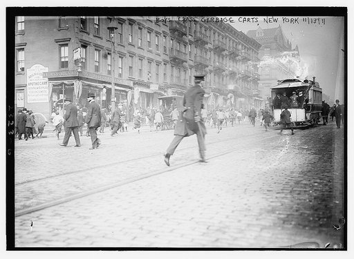 Boys chase garbage carts, New York, 1911