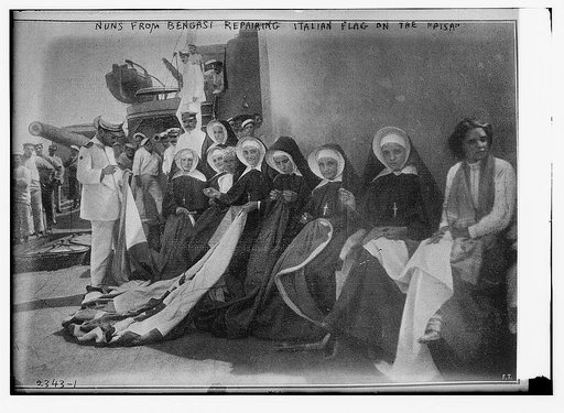 Nuns from Bengasi repairing Italian flag on the "PISA"