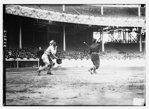 Fred Merkle (New York NL) at bat, Red Murray (New York NL) walking in background, and unidentified catcher at the Polo Grounds, NY, 1911 World Series (baseball)