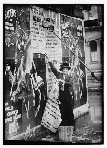 Miss Louise Hall with brush and Susan Fitzgerald assisting bill posting in Cincinnati