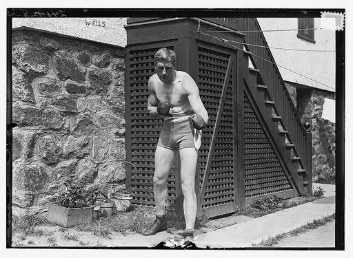 Bombardier Billy Wells, English boxer, preparing in Rye, N.Y., for fight with Al Palzer