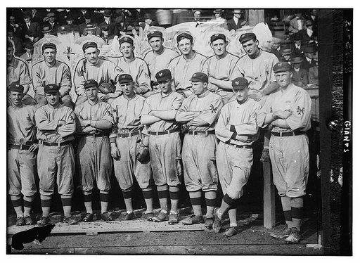 New York Giants. Top row (left to right): (partially obscured) Art Fletcher, George Burns, Art Wilson, Red Ames, Art Devlin, Christy Mathewson, Hooks Wiltse, Grover Hartley. Bottom row: Beals Becker, John McGraw, Buck Herzog, Fred Merkle, Bert Maxwell, Doc Crandall, Gene Paulette, and an unknown pla