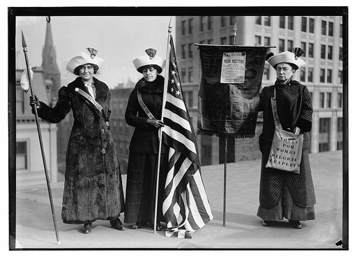 Suffragettes with flag