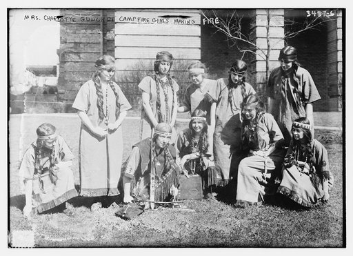 Mrs. Charlotte Gulick of Campfire Girls making fire