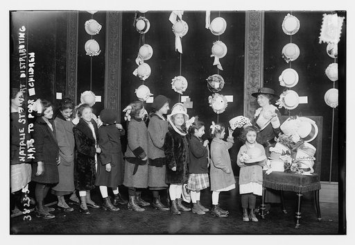 Natalie Stewart Distributing hats to poor children