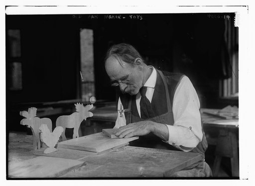 Old man making toys