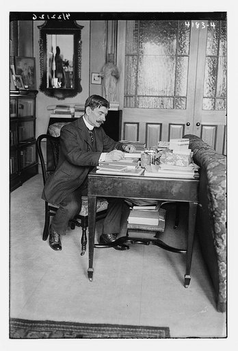 Unidentified man seated at desk