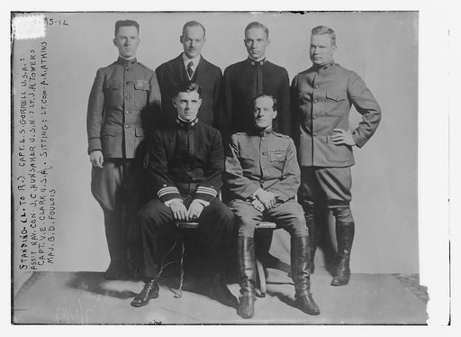Standing (L to R) Capt. E.S. Gorrell, U.S.A.; Ass't Nav. Con. J.C. Hunsaker, U.S.N.; Lt. J.H. Towers, Capt. V.E.Clark, U.S.A.; sitting: Lt. Com. A.K. Atkins, & Maj. B.D. Foulois