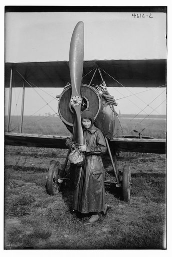 Katherine Stinson with her biplane