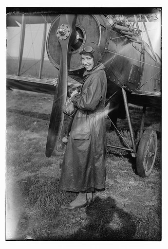 Katherine Stinson with her biplane