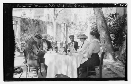 Francis Picabia and F.M. Mansfield with 2 women and a man at outdoor café table. Gassis(?)