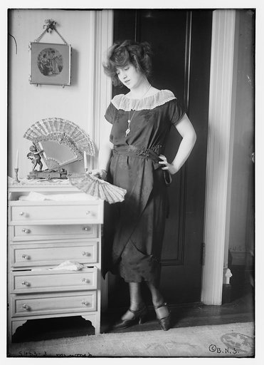 Larrimore [holding fan