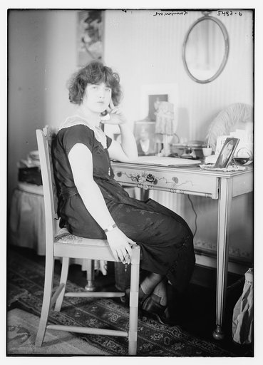 Larrimore [seated at a table