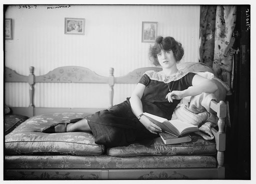 Larrimore [lying on sofa, book in hand
