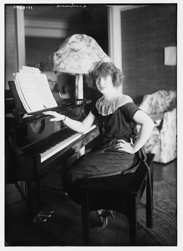 Larrimore [seated at piano