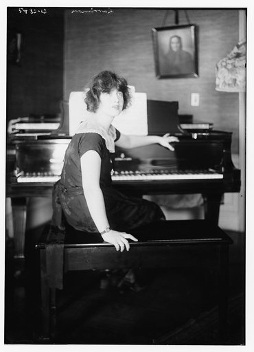 Larrimore [seated at piano