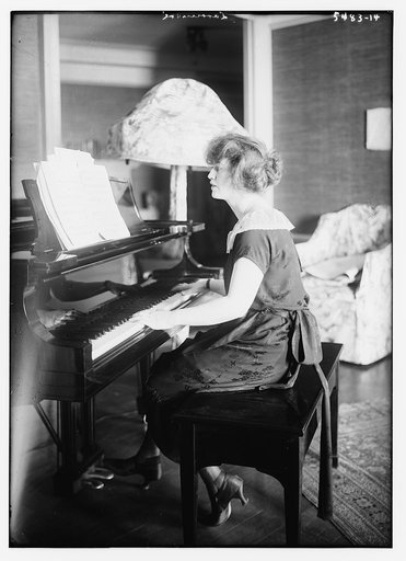 Larrimore [seated at piano