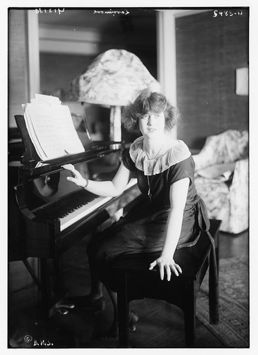 Larrimore [seated at piano