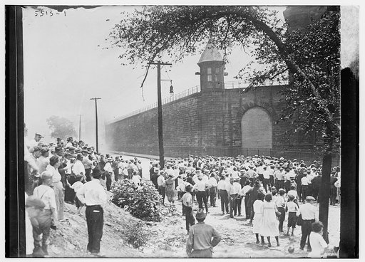 Crowd outside prison, penitentiary outbreak