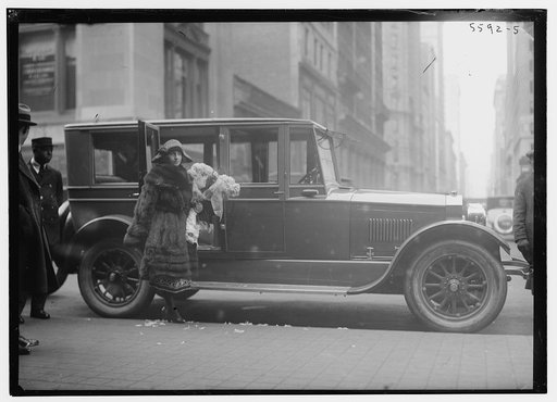 Italian coloratura soprano opera singer Amelita Galli-Curci (1882-1963), standing next to an automobile