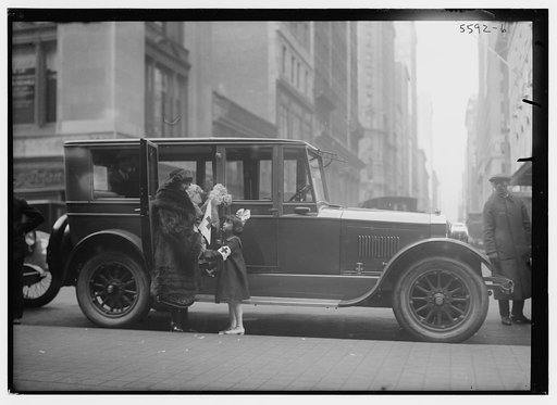Italian coloratura soprano opera singer Amelita Galli-Curci (1882-1963), standing next to an automobile