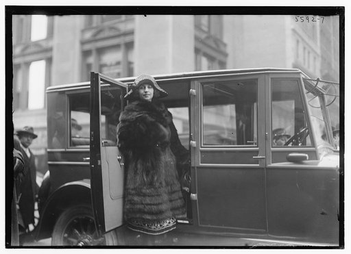 Italian coloratura soprano opera singer Amelita Galli-Curci (1882-1963), standing next to an automobile