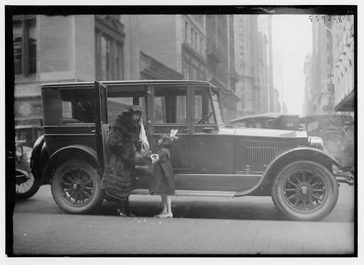 Italian coloratura soprano opera singer Amelita Galli-Curci (1882-1963), standing next to an automobile