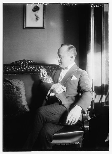 J.C. Smith [siting with small statue in his arms