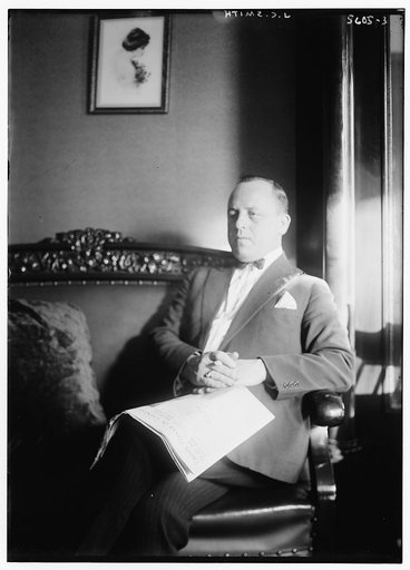 J.C. Smith [sitting on sofa