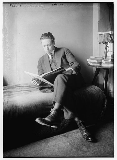 Bonelli [seated in bed, reading