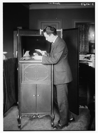 Bonelli [putting record on machine