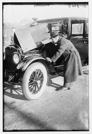 Chamlee [looking at motor of auto