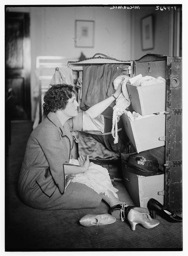 McCormic [on floor, near open trunk