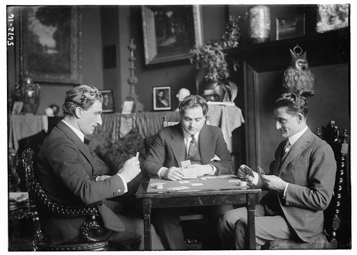 Beniamino Gigli and three men playing cards