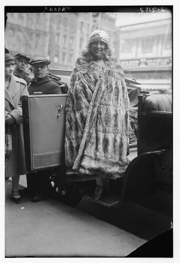 Farrar [wearing full length fur coat