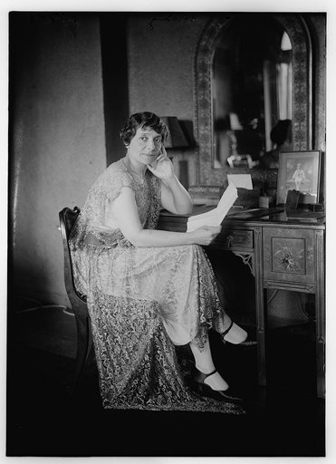 Liebling [seated at dressing table